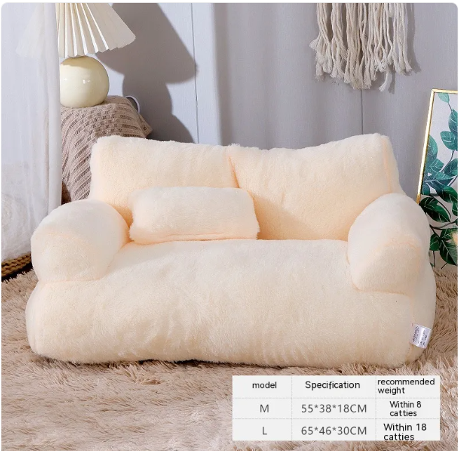 Fluffy white bean bag chair in a room setting with a lamp and plant.